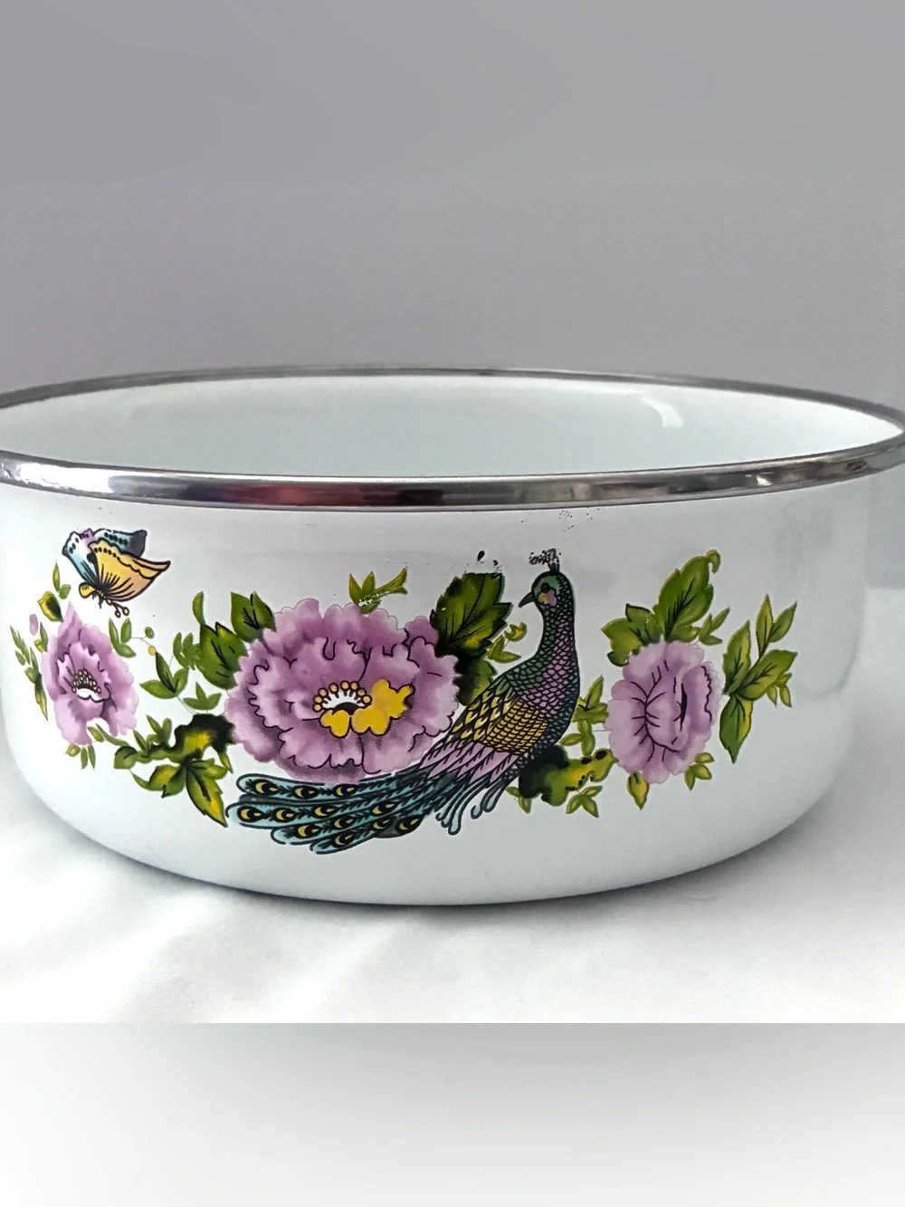 Vintage enamel mixing bowls featuring peacock and floral pattern